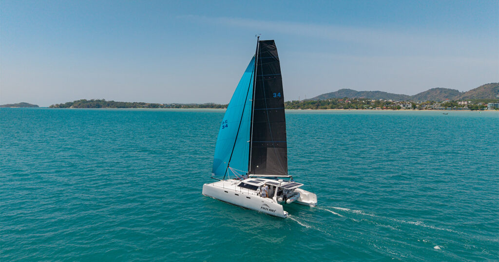 Stealth 13.2 catamaran sailing Phuket coastline offshore