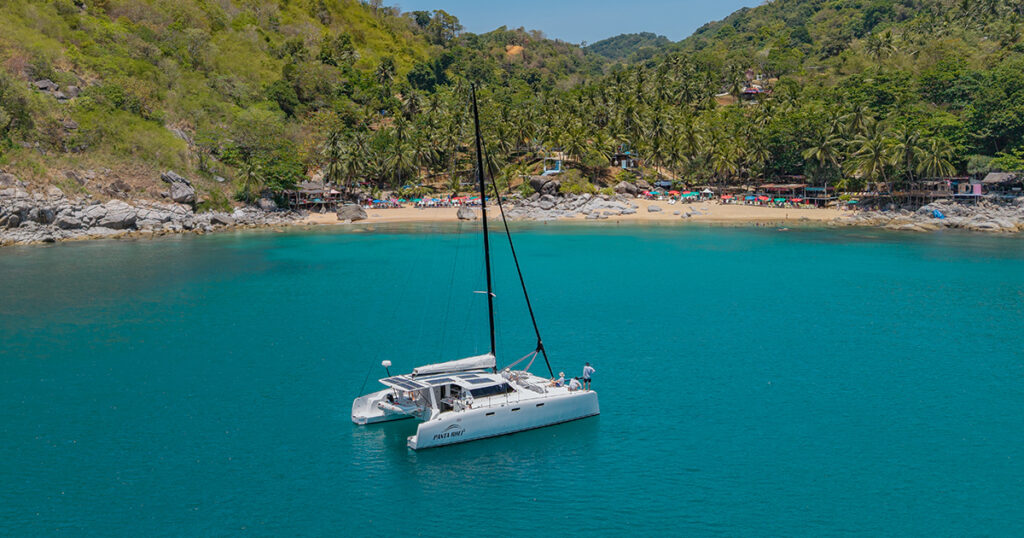 Stealth 13.2 catamaran anchored tropical beach Phuket Thailand