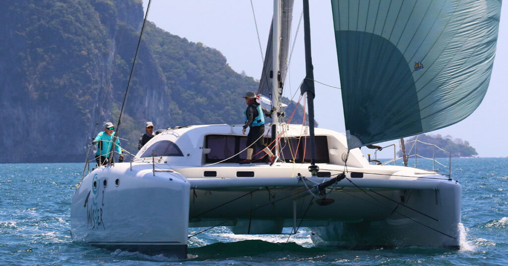 Stealth 12M Twister 2 bow-on sailing fast under spinnaker Bay Regatta Thailand