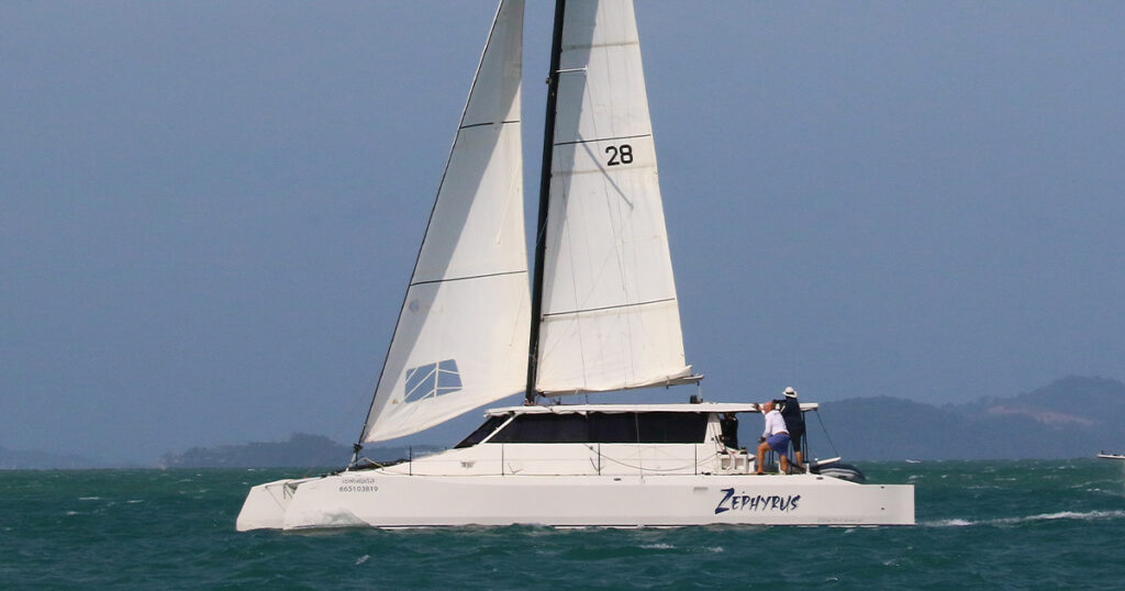 Stealth X Series 43 Zephyrus sailing catamaran underway off Phuket coastline.