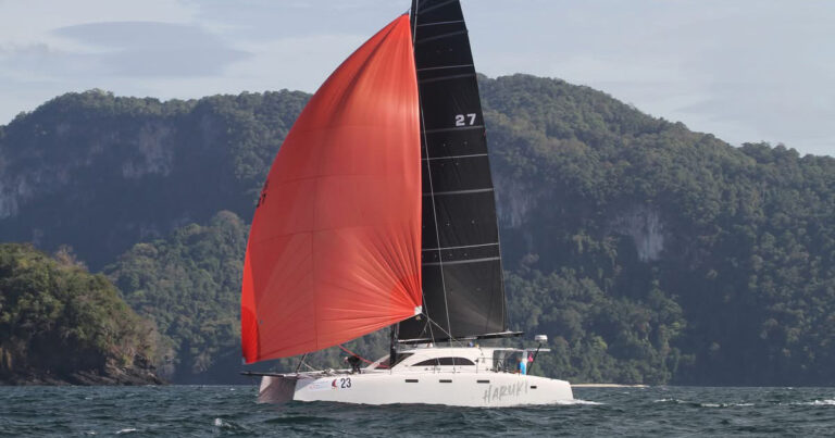 Stealth catamaran Haruki racing under spinnaker during the 2025 Langkawi Regatta