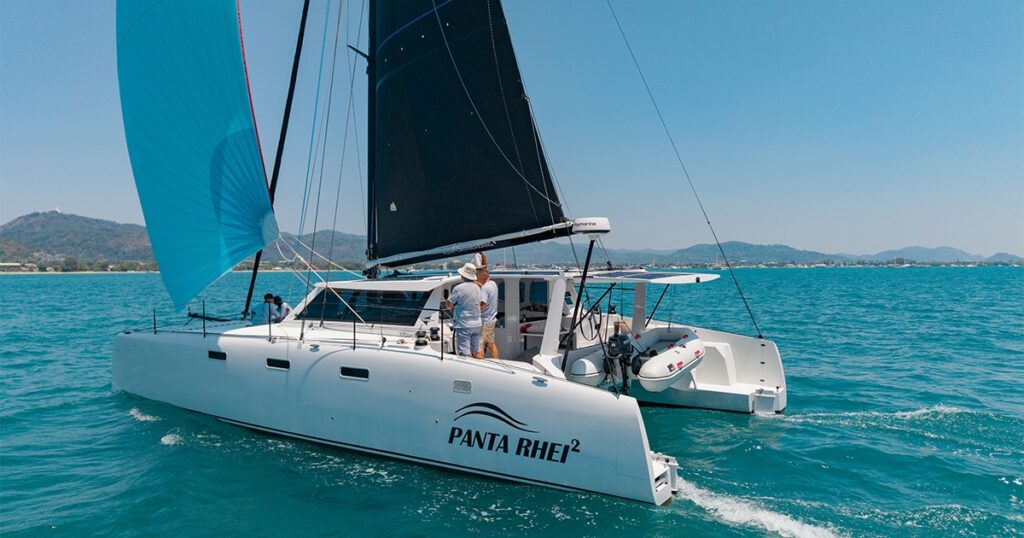 Stealth 13.2 performance catamaran Panta Rhei² sailing under blue spinnaker