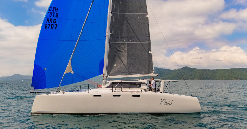 Stealth 13S Bliss 2 sailing under blue asymmetric spinnaker