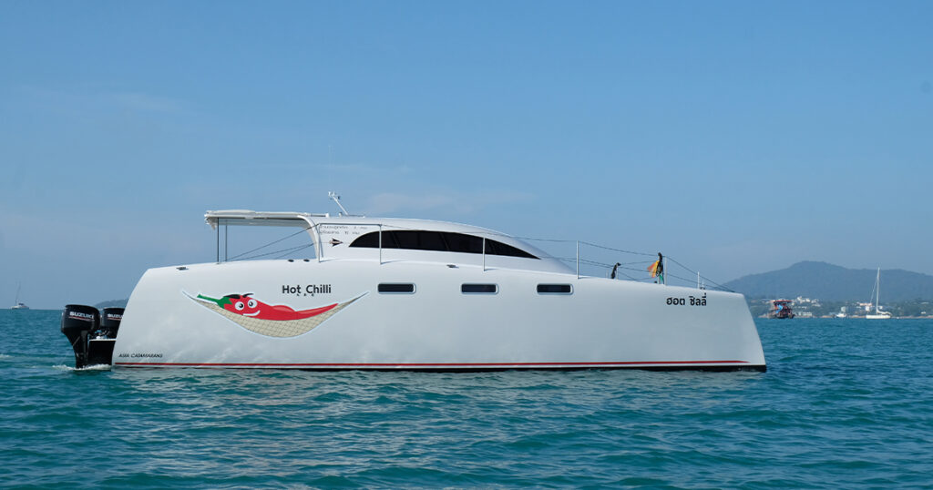 Stealth 36 Power Catamaran Hot Chilli side profile underway